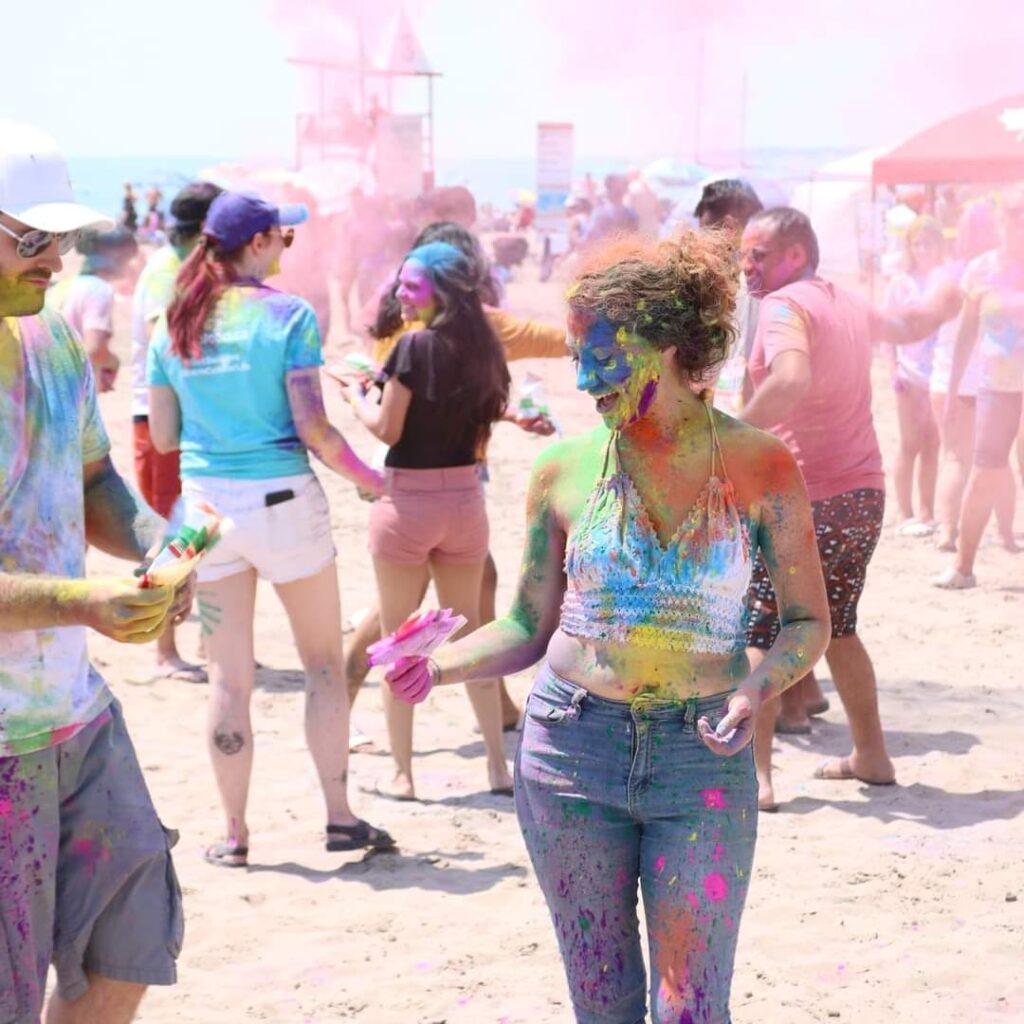 Morgaine participating in the Colours on the Beach festival, Port Stanley, 2024.