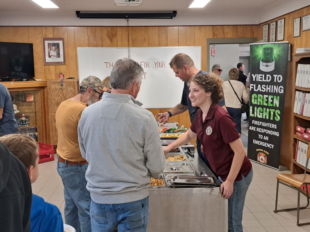 Morgaine helps to serve breakfast at the Union Firehall breakfast, 2025.